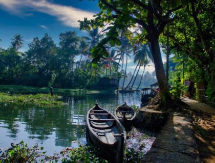 istockphoto-1246366598-612×612 A scenic view of boats under a blue sky in backwaters situated in Allepey town located in Kerala state, India